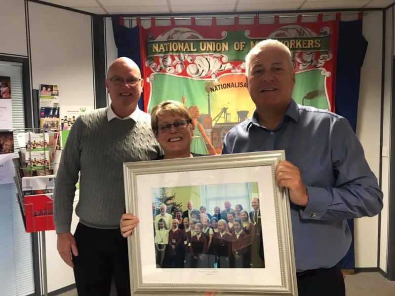 Ian Lavery MP presented with a photograph from Pegswood First School