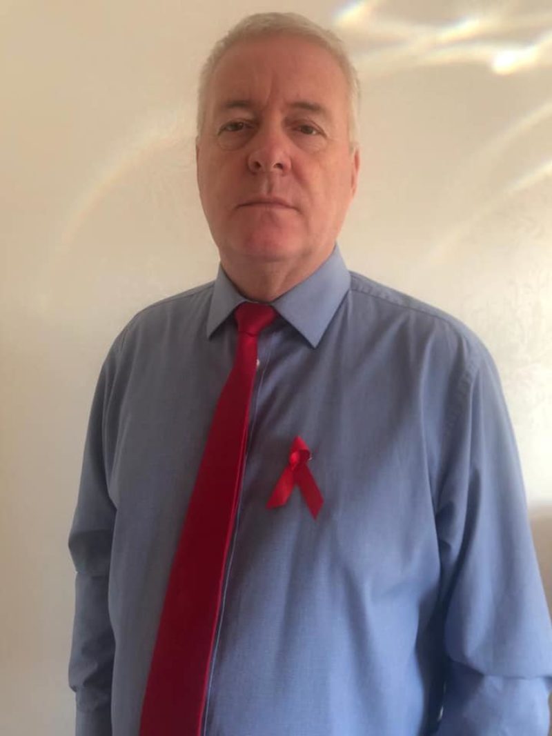 Wearing a red ribbon for the 32nd World Aids Day